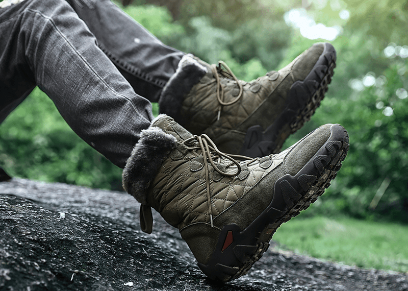 Lace-up waterproof mid-calf snow boots with fur, featuring non-slip rubber outsoles, perfect for winter wear on snowy trails.